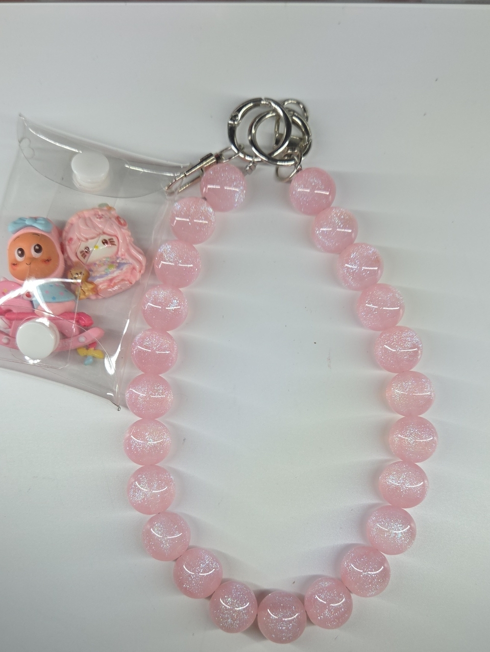 Beautiful Pink Glitter Bead Chain with Keyring & Pouch W/HK Piano & Twinkle.